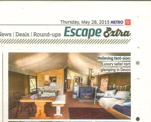 A newspaper cutting showing the inside of a Brownscombe safari tent taken from The Metro newsapaper's 2015 glamping feature