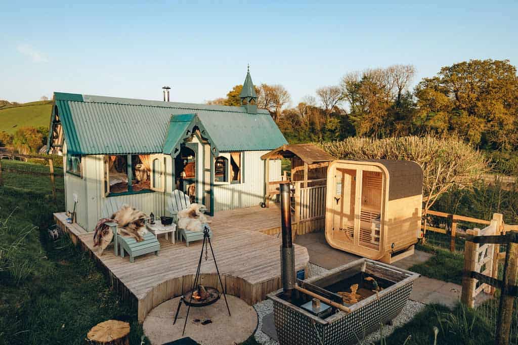 Sunset view of the Tabernacle deck featuring the wood-fired hot tub, sauna and fire pit BBQ.